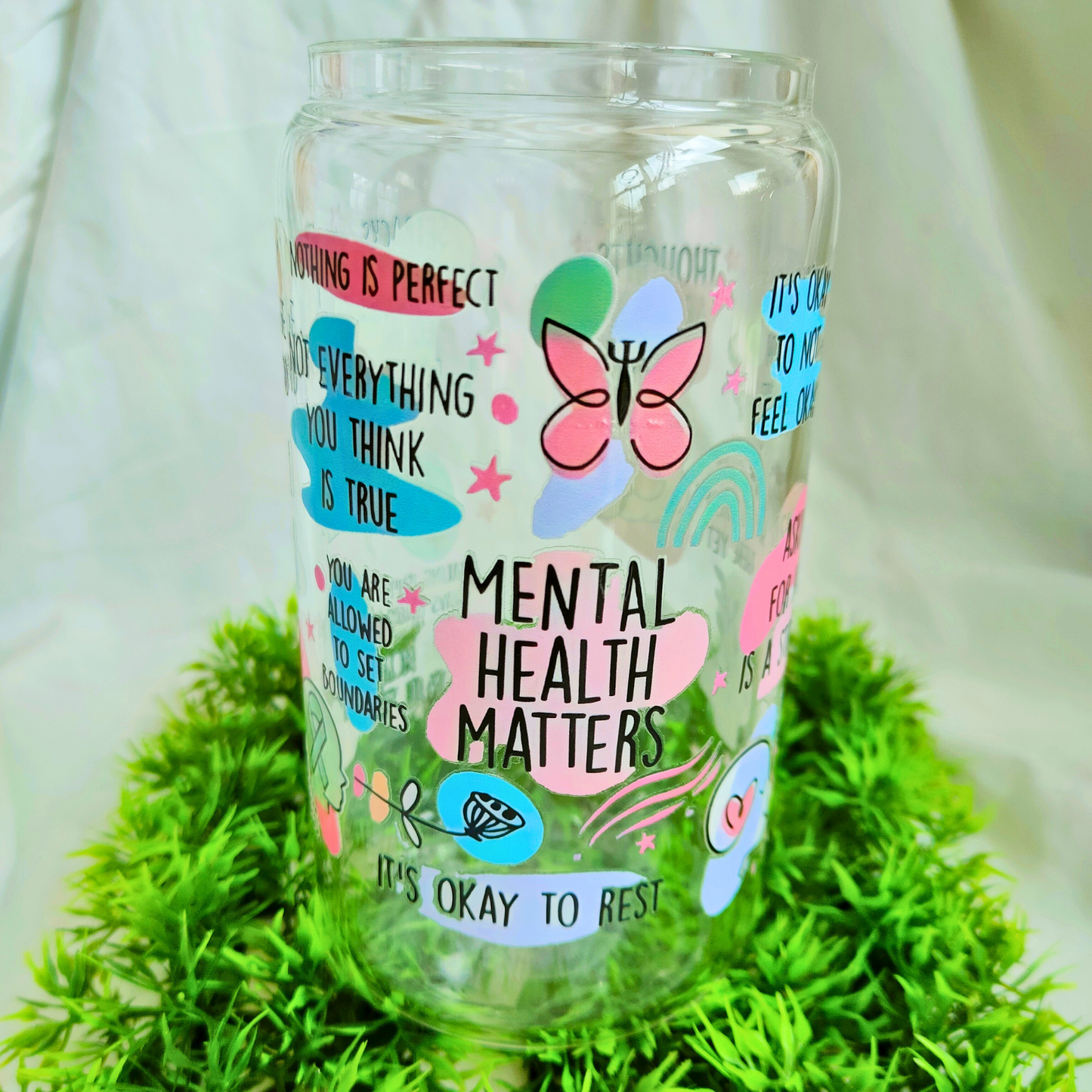 clear glass cup with meantal health matters print.