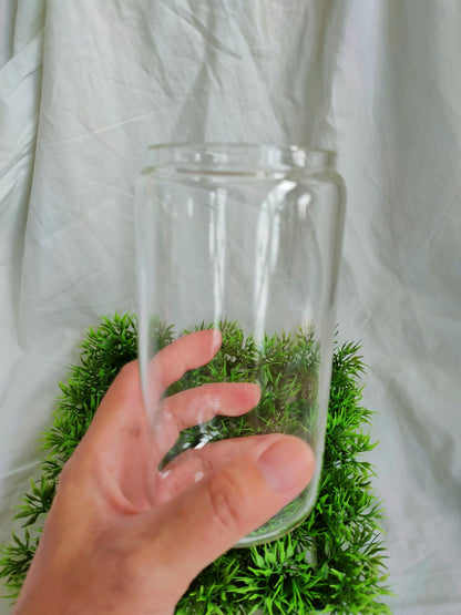 a hand holding glass cup size 470ml